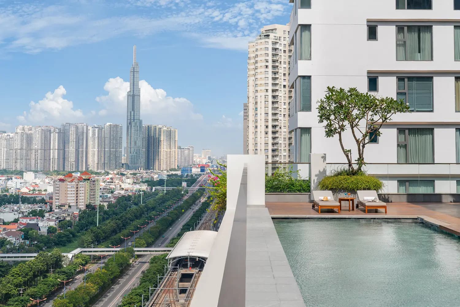 The Berkley rooftop pool over the Saigon skyline