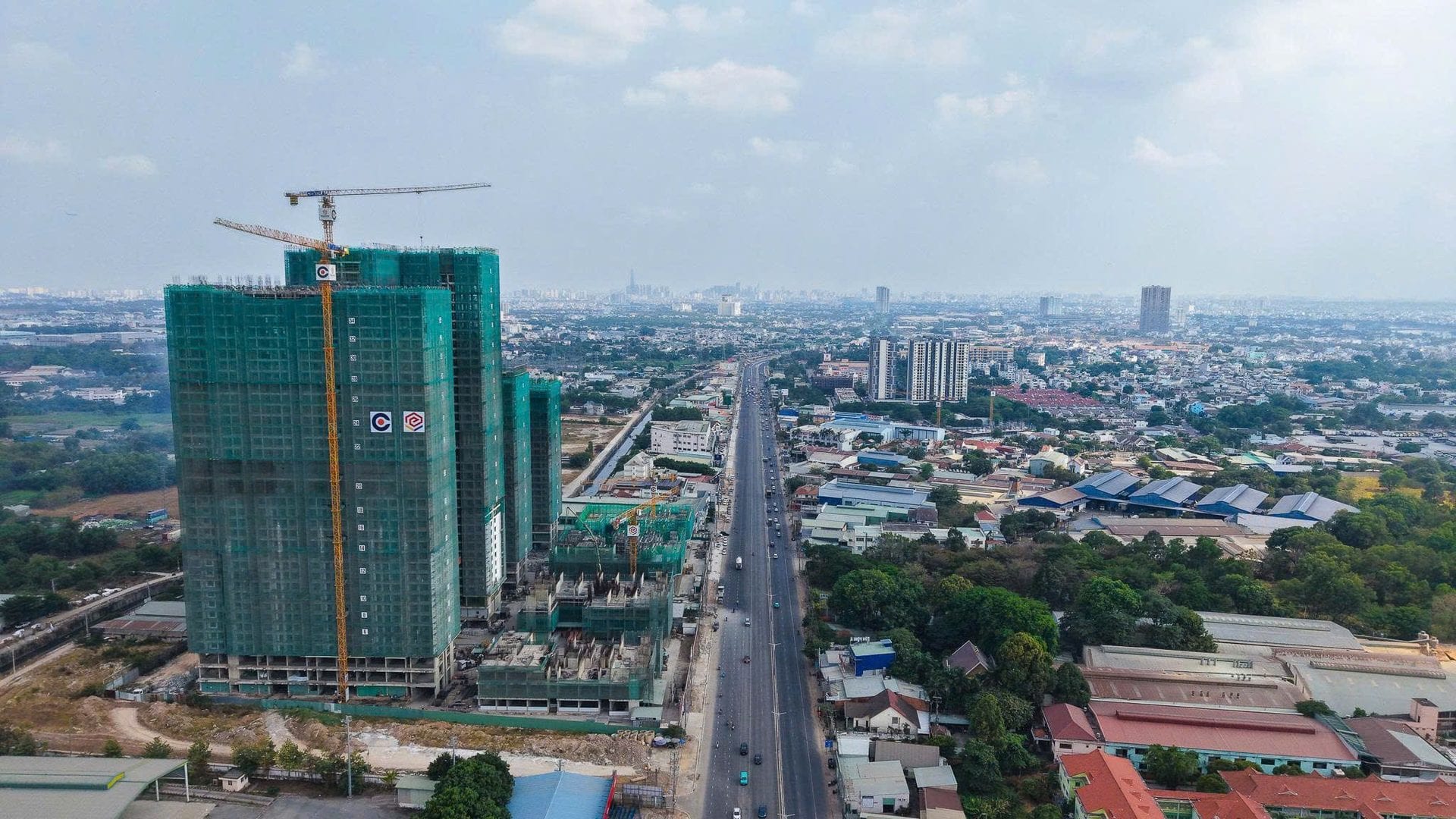 Lusso Saigon construction progress — aerial over Highway 13