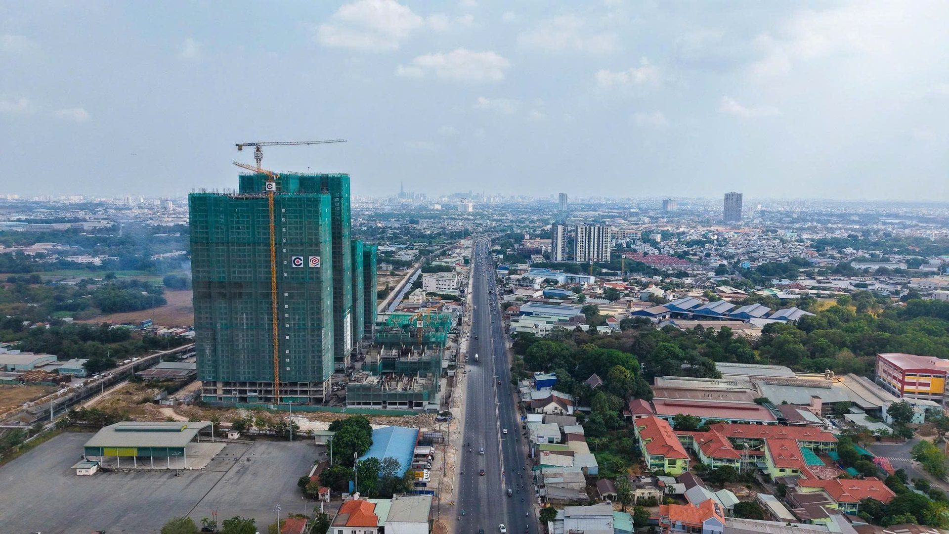 Lusso Saigon twin towers wide drone shot